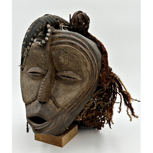 498 - 1930s African full tribal headdress from Cameroon, with horn and woven details, 35cm high on stand