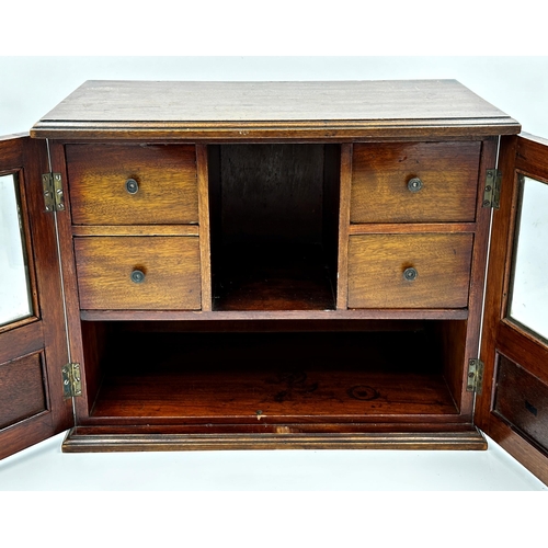 543 - Early 20th century mahogany smokers cabinet, twin glazed doors enclosing an interior fitted with fou... 