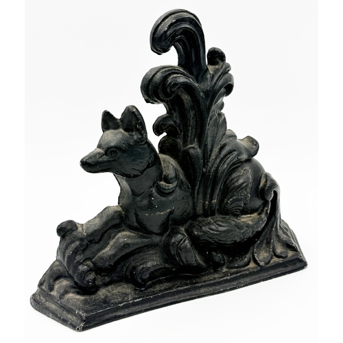 241 - Antique cast iron door porter in the form of a recumbent fox, 29 x 35cm