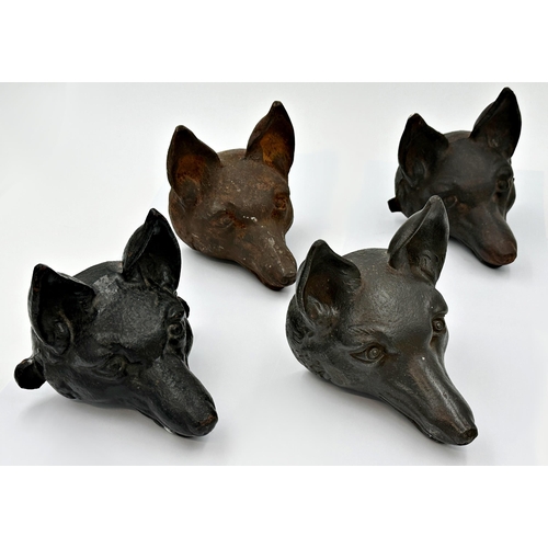 242 - Set of four cast iron fox heads, possibly wall mounts, each 15cm high x 15cm deep (4)