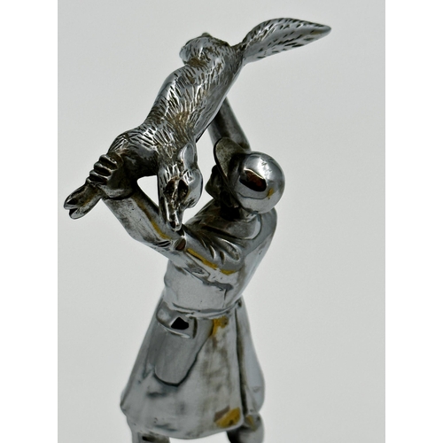 230 - Cast white metal figure of a hunter holding a fox aloft, on Bakelite plinth, 21cm high