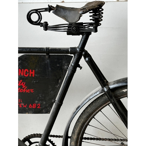 7 - Good early 20th century Butcher's delivery bicycle, with woven front basket and advertising panel in... 