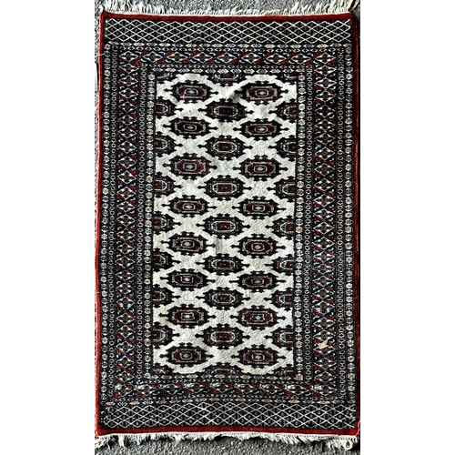 1408 - Bokhara rug with typical geometric medallion decoration on a cream ground, 175 x 195cm