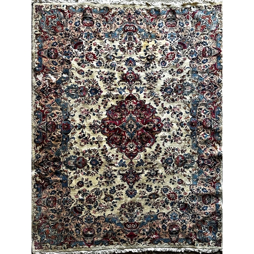 1411 - Large full pile country house Tabriz carpet, red a blue medallions on a cream ground, 350 x 245cm