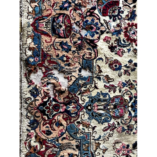 1411 - Large full pile country house Tabriz carpet, red a blue medallions on a cream ground, 350 x 245cm