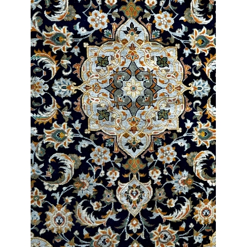 1412 - Good Keshan rug, gilt and sky blue scrolled foliate decoration on blue ground, 195 x 145cm