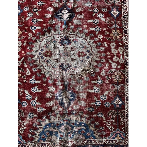 1413 - Old Mahal rug with typical Islamic scrolls on red ground, 180 x 145cm with a similar Tabriz rug (af)... 