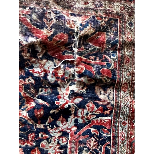 1413 - Old Mahal rug with typical Islamic scrolls on red ground, 180 x 145cm with a similar Tabriz rug (af)... 