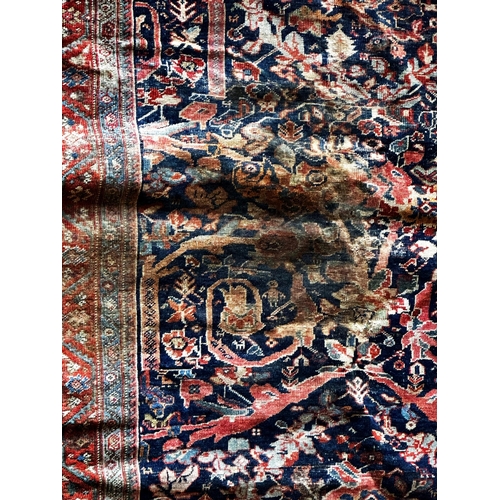 1413 - Old Mahal rug with typical Islamic scrolls on red ground, 180 x 145cm with a similar Tabriz rug (af)... 