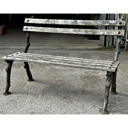 1043 - Antique cast iron framed teak bench, with naturalistic branch framework, 120cm long x 84cm high x 63... 