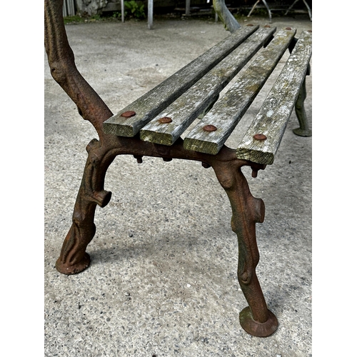 1043 - Antique cast iron framed teak bench, with naturalistic branch framework, 120cm long x 84cm high x 63... 