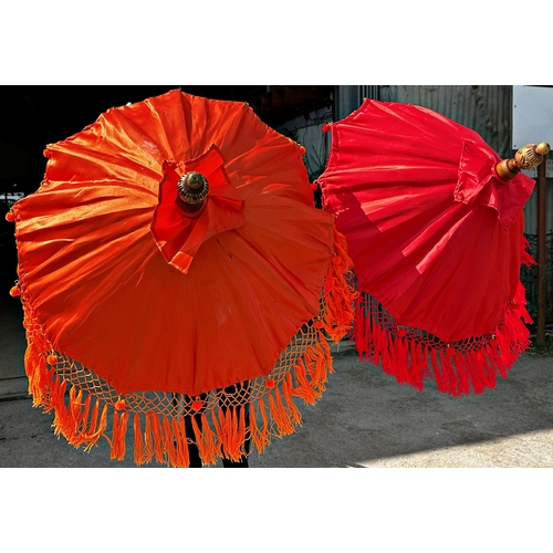 1050 - Pair of Eastern colourful long parasols,
Height 254cm x 83cm Diameter (Open)