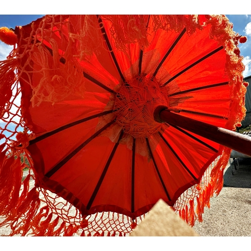 1050 - Pair of Eastern colourful long parasols,
Height 254cm x 83cm Diameter (Open)