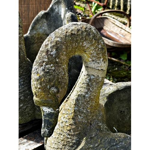 1057 - Pair of reconstituted stone planters in the form of swans, Height 49cm x Length 58cm x Width 42cm