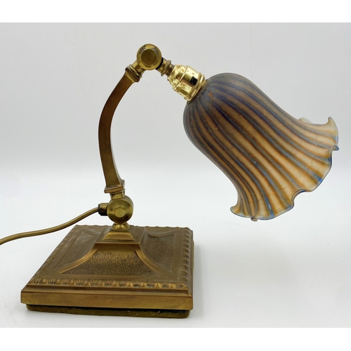 1124 - Good early 20th century Art Nouveau brass desk lamp, with hinged curved column and mottled glass sha... 