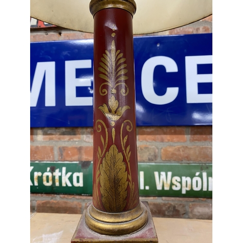 1125 - Good quality antique toleware table lamp and shade, with gilt decoration on a red ground, 79cm high