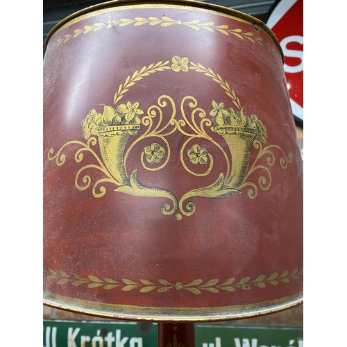 1125 - Good quality antique toleware table lamp and shade, with gilt decoration on a red ground, 79cm high