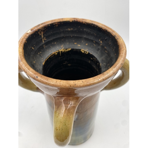 469 - Studio pottery four handled vase, with green and brown glaze, 37xm high