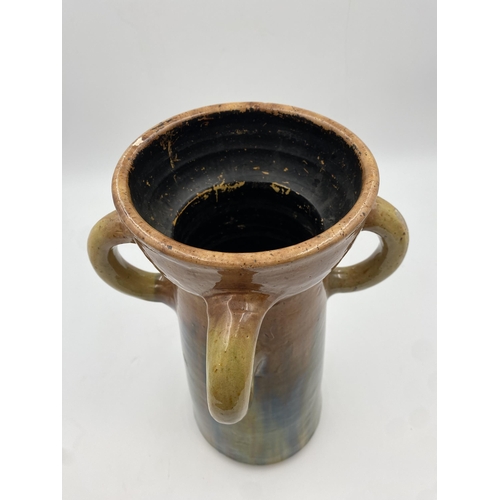 469 - Studio pottery four handled vase, with green and brown glaze, 37xm high