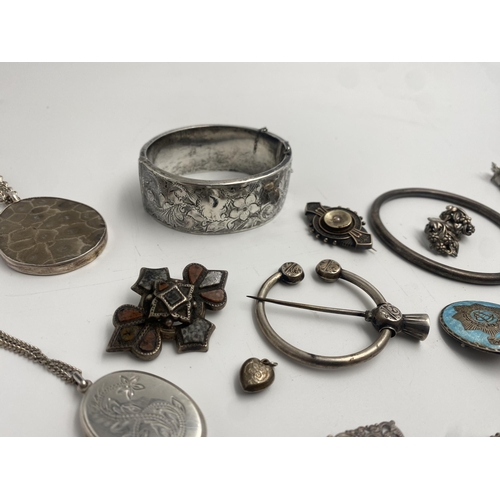 316 - Large collection of good silver jewellery comprising large hinged bangle, two locket pendants, kilt ... 