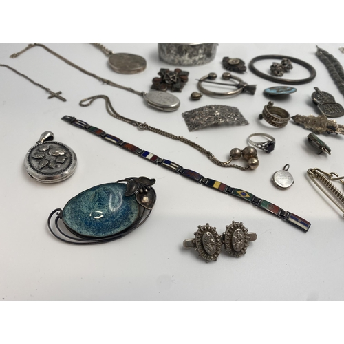 316 - Large collection of good silver jewellery comprising large hinged bangle, two locket pendants, kilt ... 