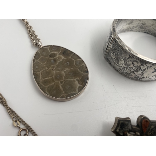 316 - Large collection of good silver jewellery comprising large hinged bangle, two locket pendants, kilt ... 