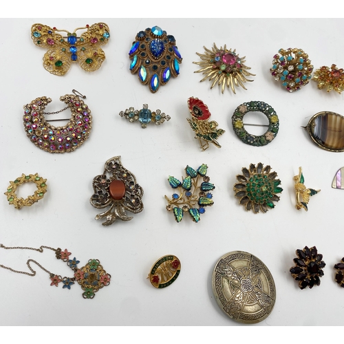 336 - Large collection of costume jewellery to include a good quantity of brooches, necklaces, pin badges ... 