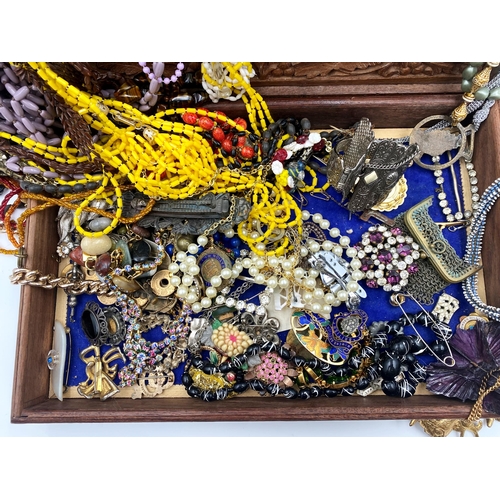 336 - Large collection of costume jewellery to include a good quantity of brooches, necklaces, pin badges ... 