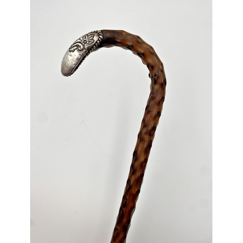 412 - A late Victorian/Edwardian silver topped hawthorn walking stick, embossed floral decoration and init... 