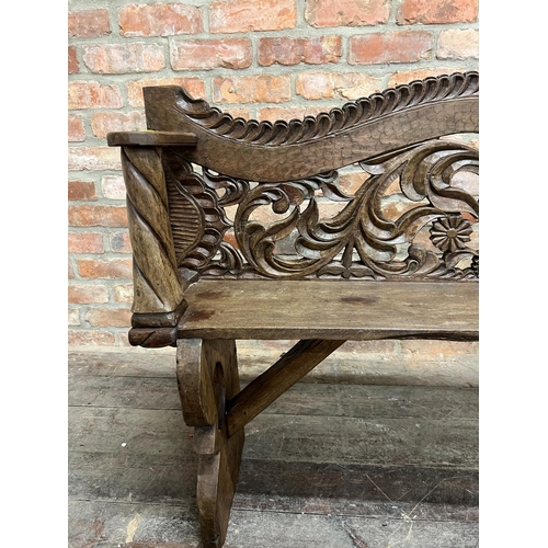 1363 - 19th century Chinese hardwood bench of slim proportions, the backrest carved with coiled serpents wi... 