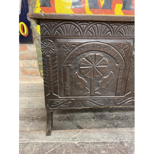 1372 - 17th century oak coffer, three arcaded carved panel front, hinged lid, 66cm high x 146cm long