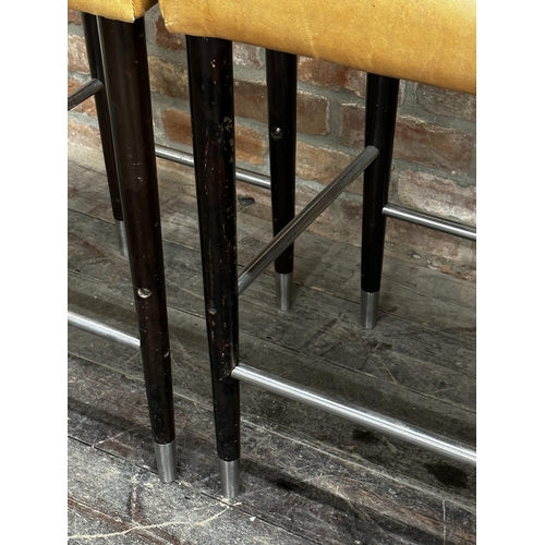 1211 - Set of 4 probably Italian tan leather bar stools on ebonised tapered legs with steel stretchers and ... 