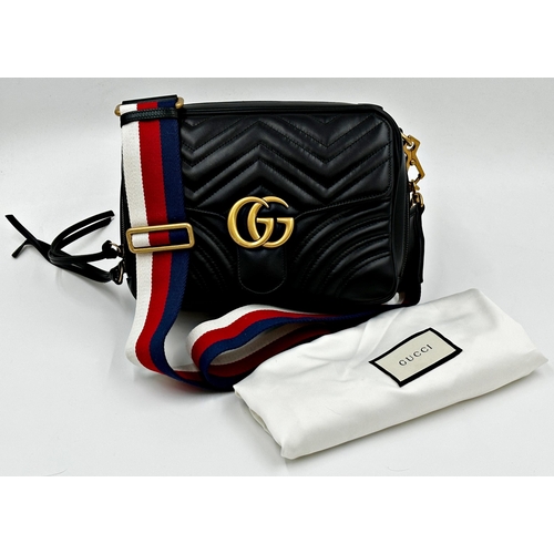 257 - A brand new Gucci GG Marmont flap calfskin black leather handbag featuring a top handle and adjustab... 