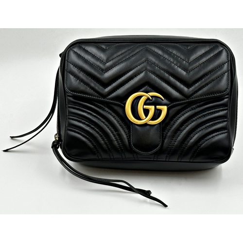 257 - A brand new Gucci GG Marmont flap calfskin black leather handbag featuring a top handle and adjustab... 