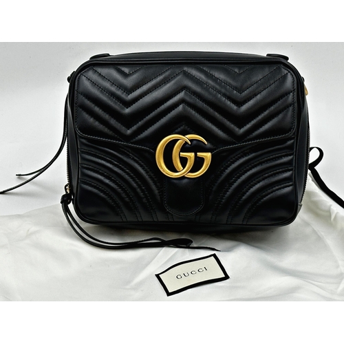 257 - A brand new Gucci GG Marmont flap calfskin black leather handbag featuring a top handle and adjustab... 