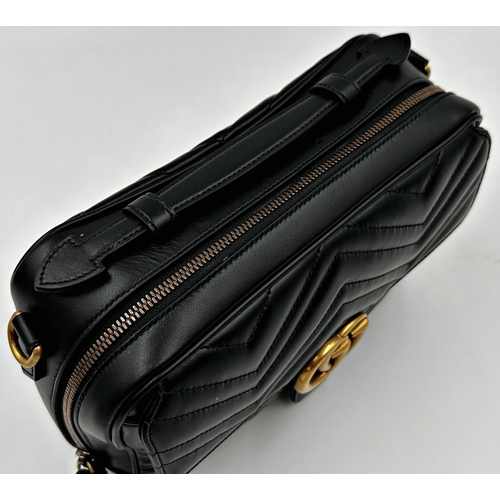 257 - A brand new Gucci GG Marmont flap calfskin black leather handbag featuring a top handle and adjustab... 