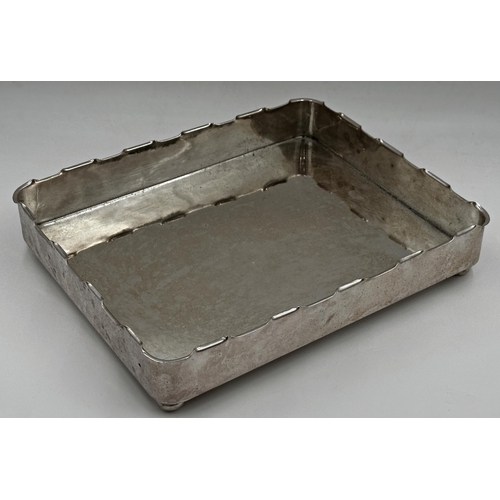 100 - Silver Plated tray with stylised turreted rim, sat upon four ball feet. h7 x l36.3 x w29.5cm