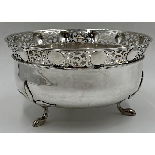 136 - Exceptional quality Edwardian silver fruit bowl, pierced scrolled rim and cast floral feet, maker Wa... 