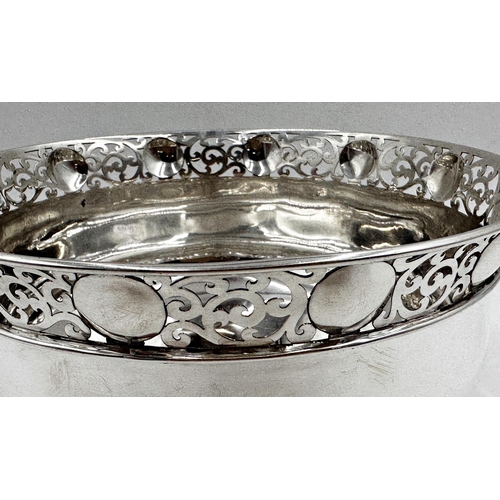 136 - Exceptional quality Edwardian silver fruit bowl, pierced scrolled rim and cast floral feet, maker Wa... 