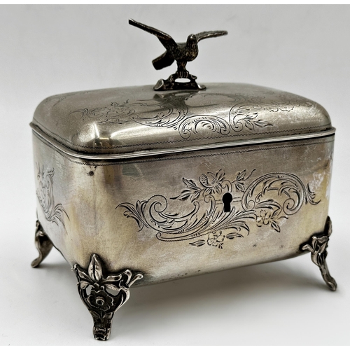 155 - Continental Polish silver caddy, mounted by a bird, engraved with scrolled decoration and cast feet,... 