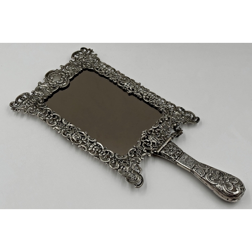 167 - Remarkable late Victorian silver hand / easel mirror, the frame pierced with hinged handle, pierced ... 