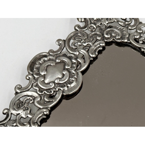 167 - Remarkable late Victorian silver hand / easel mirror, the frame pierced with hinged handle, pierced ... 