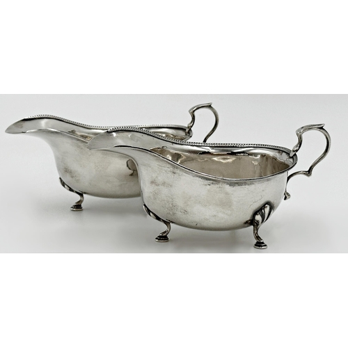 196 - Pair of George V silver sauce boats, darted rims, maker E S Barnsley, Birmingham 1919/20, 16cm long,... 