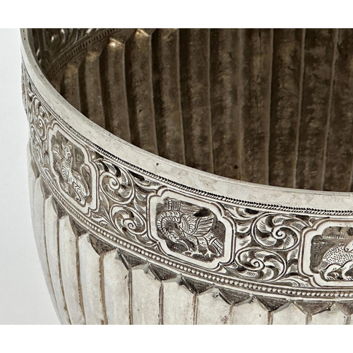 202 - Good late 19th century silver rice bowl, the rim with panels of animals over scrolled foliage, flute... 