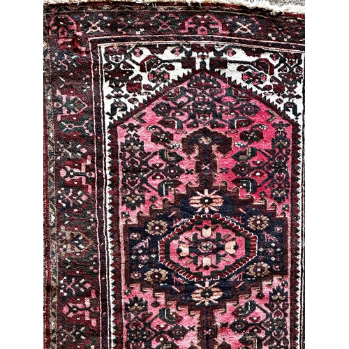 1444 - Persian full pile Hamadam rug, floral medallions on deep red ground, 190 x 130cm