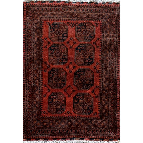 1445 - Persian full pile Bokhara rug, with typical medallion decoration on a deep orange ground, 175 x 120