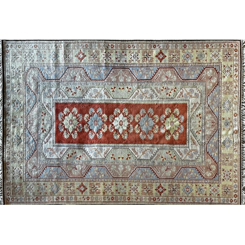 1455 - Large Turkish caucasion country house carpet with central red panel with various further pastel meda... 