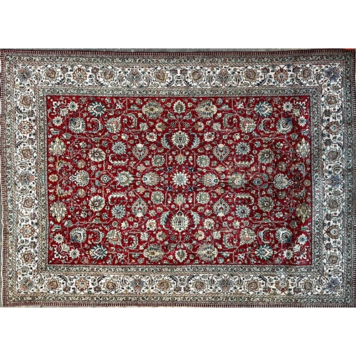 1456 - Large Persian Tabriz country house carpet with scrolled medallions upon a red ground, bears signatur... 