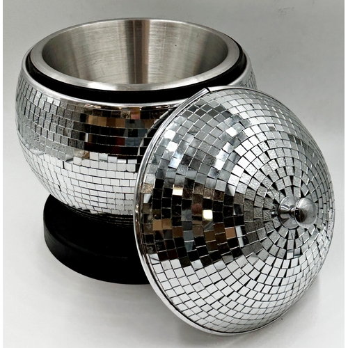 427 - A novelty ice bucket in the form of a mirrored glass disco ball upon a black ebonised plinth base, 3... 