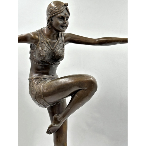 365 - J Philipps - Art Deco figure of a dancer upon a stepped circular marble plinth, 55cm high.